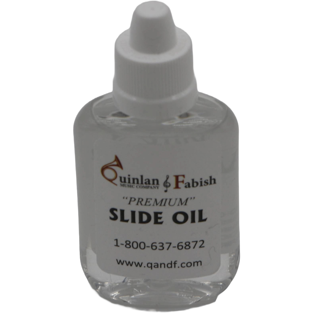 Clear bottle with white label of Q&F slide oil