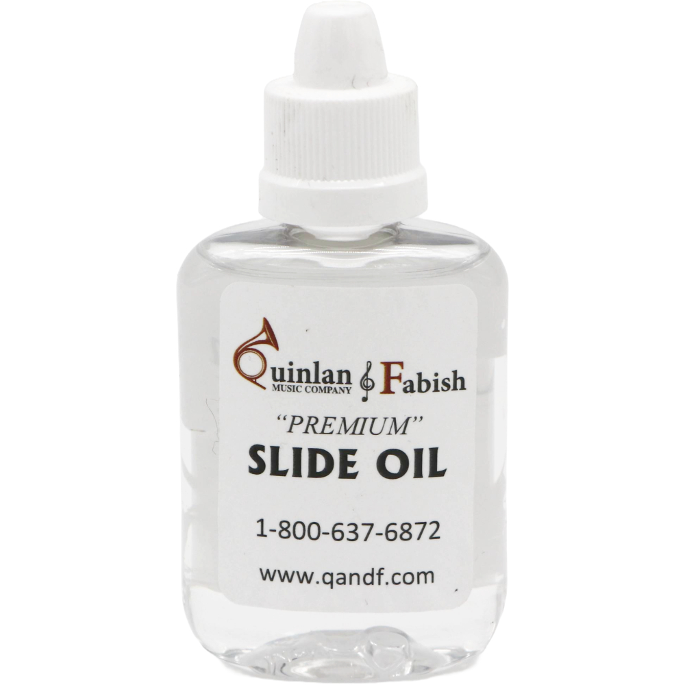 Clear bottle with white label of Q&F slide oil