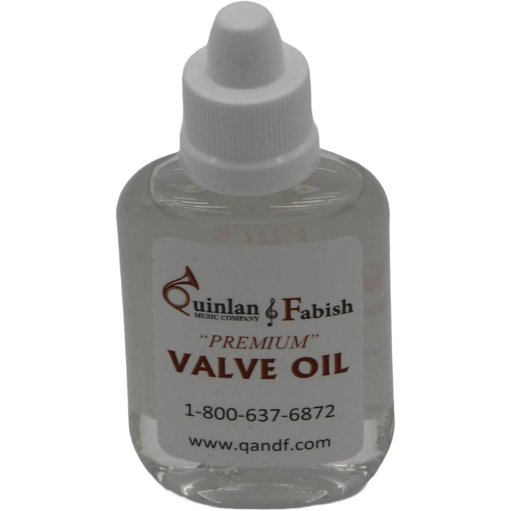 clear bottle with a white label of Q&F valve oil