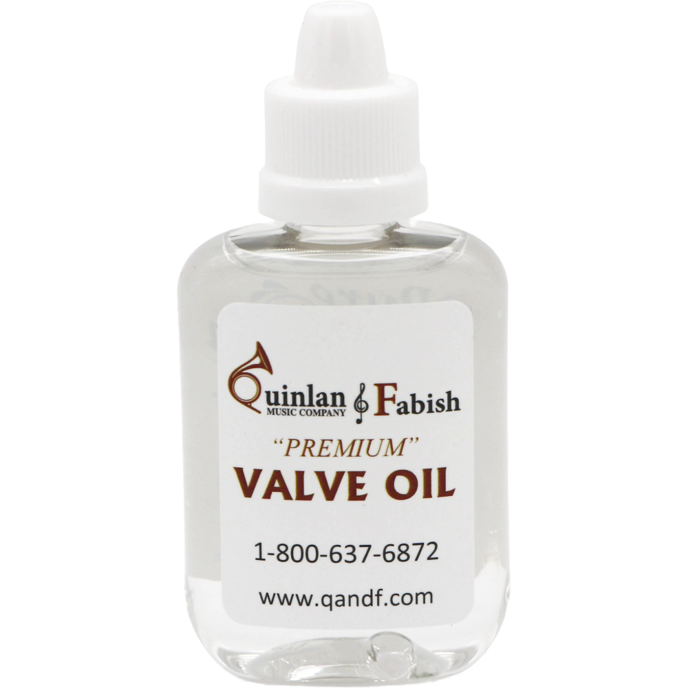 clear bottle with a white label of Q&F valve oil